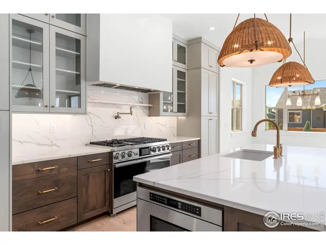 a kitchen with a stove and a sink