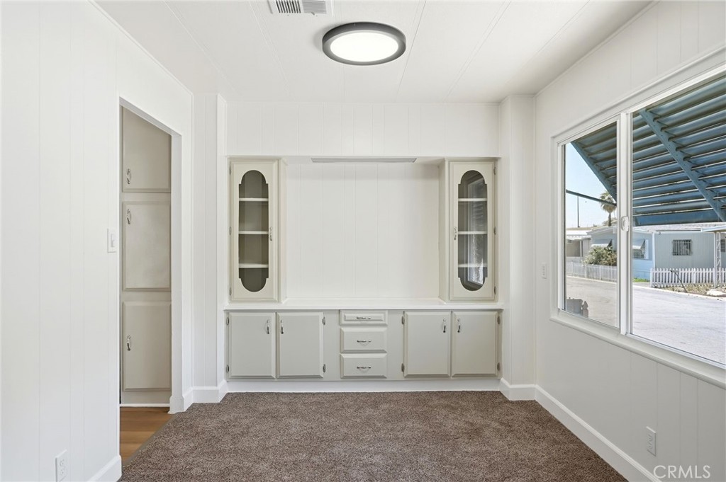 2250 West Mill Street, Unit 104 Colton, CA 92324 - Photo 11 of 28 wooden floor in ceiling room and window