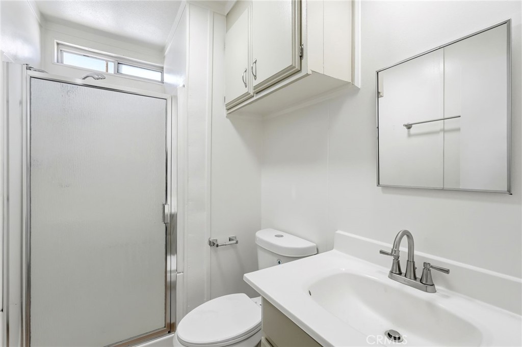 2250 West Mill Street, Unit 104 Colton, CA 92324 - Photo 18 of 28 a bathroom with a sink toilet and shower