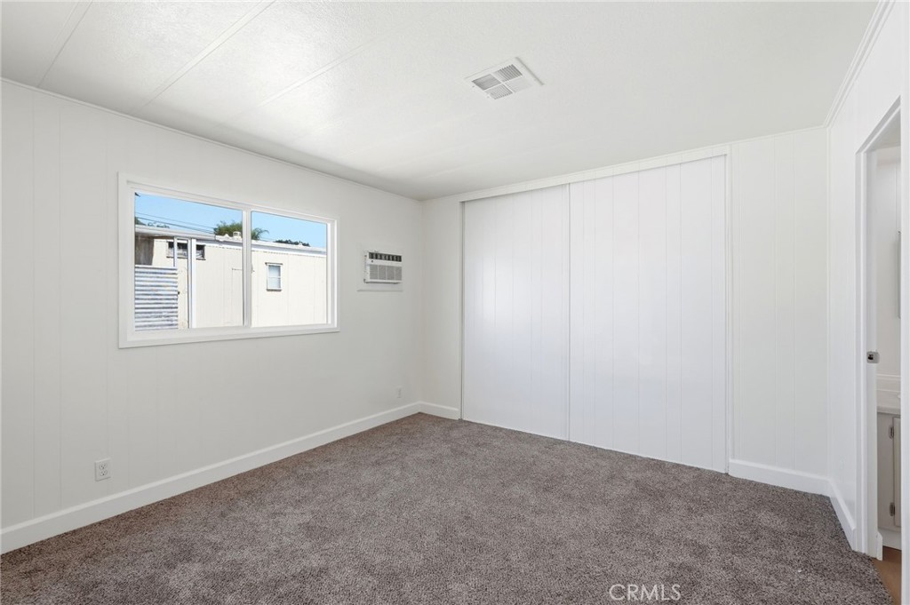 2250 West Mill Street, Unit 104 Colton, CA 92324 - Photo 19 of 28 a view of an empty room with a window