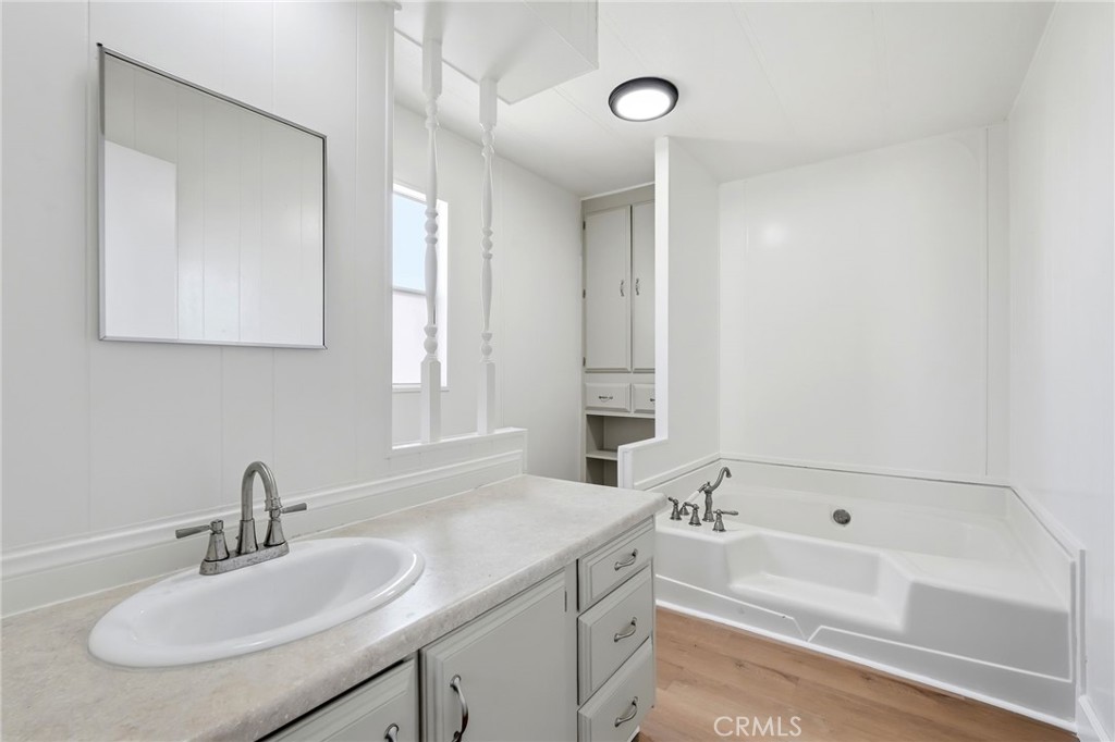 2250 West Mill Street, Unit 104 Colton, CA 92324 - Photo 22 of 28 a bathroom with a sink and a bathtub