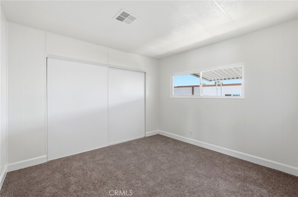 2250 West Mill Street, Unit 104 Colton, CA 92324 - Photo 24 of 28 an empty room with a window