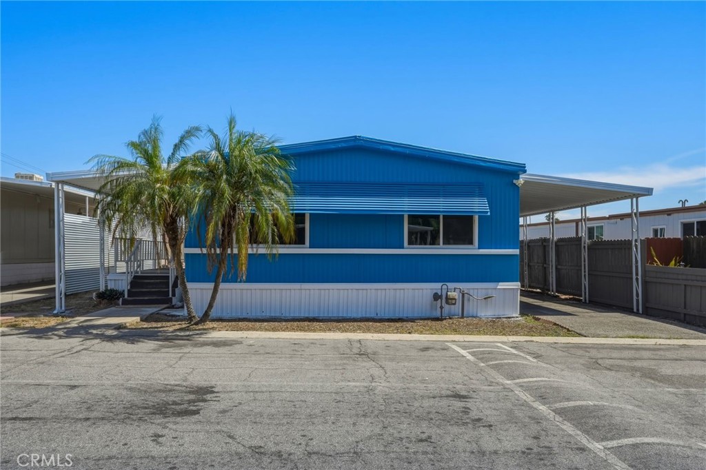 2250 West Mill Street, Unit 104 Colton, CA 92324 - Photo 3 of 28 a house with a yard