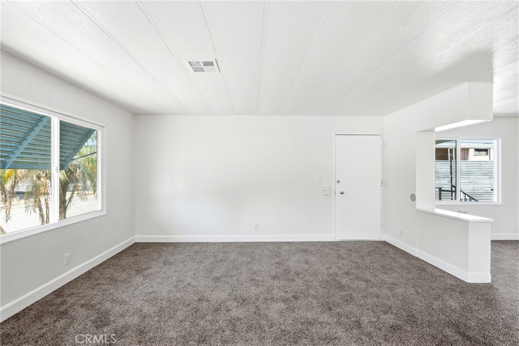 2250 West Mill Street, Unit 104 Colton, CA 92324 - Photo 8 of 28 an empty room with windows