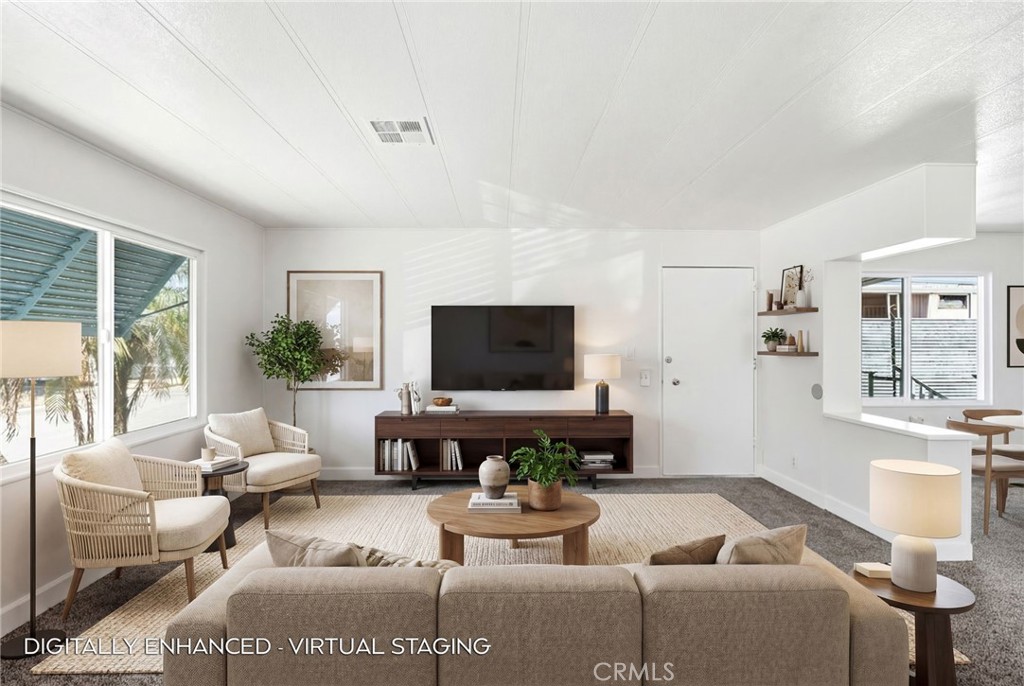 2250 West Mill Street, Unit 104 Colton, CA 92324 - Photo 9 of 28 a living room with furniture and a flat screen tv