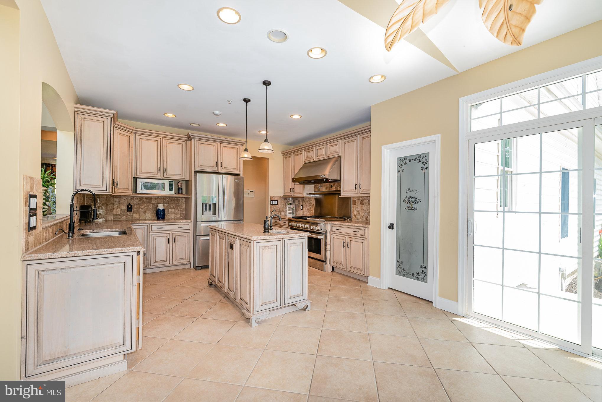 5330 Long Corner Road White Hall, MD 21161 - Photo 11 of 66 a kitchen with white cabinets and white appliances
