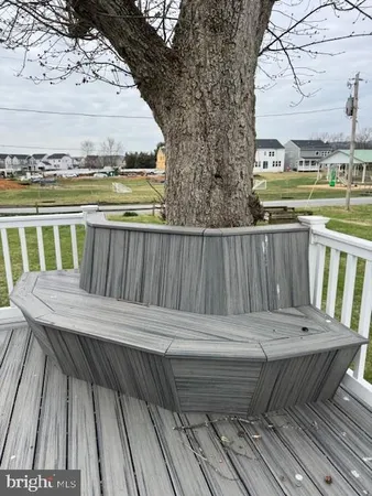 a view of wooden deck with a chairs