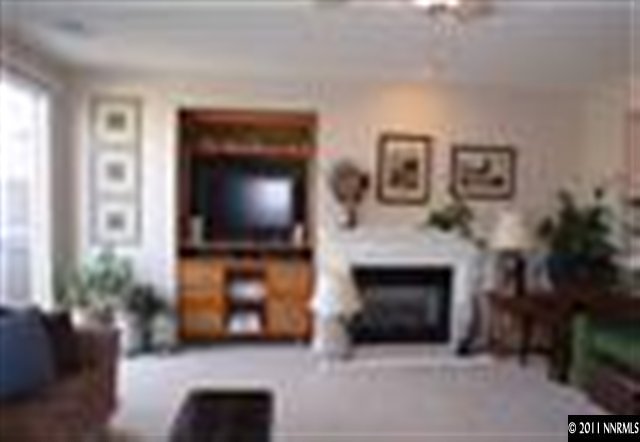441 Alysheba Court Reno, NV 89521 - Photo 5 of 8 a living room with furniture and a flat screen tv