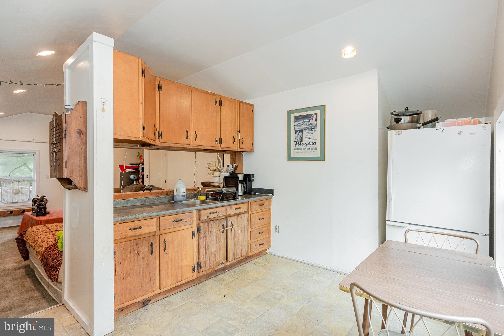255 Lums Road North East, MD 21901 - Photo 18 of 27 a kitchen with stainless steel appliances granite countertop a refrigerator sink and white cabinets