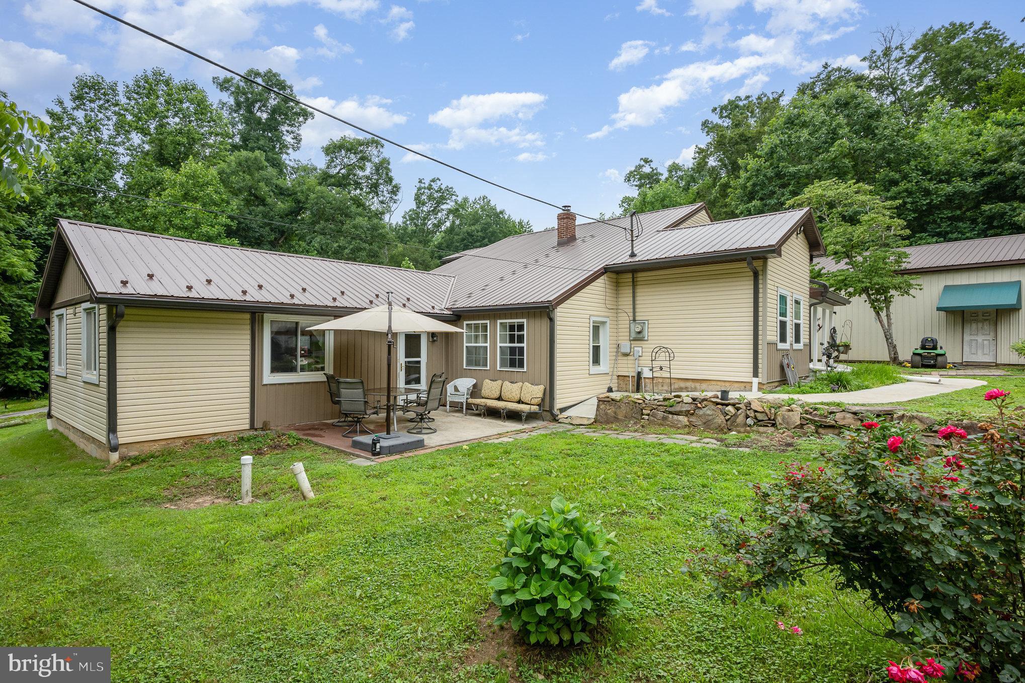 255 Lums Road North East, MD 21901 - Photo 25 of 27 a view of a house with backyard sitting area and garden