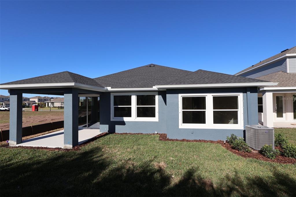 5263 Everlong Drive Apollo Beach, FL 33572 - Photo 15 of 18 a front view of a house with a yard