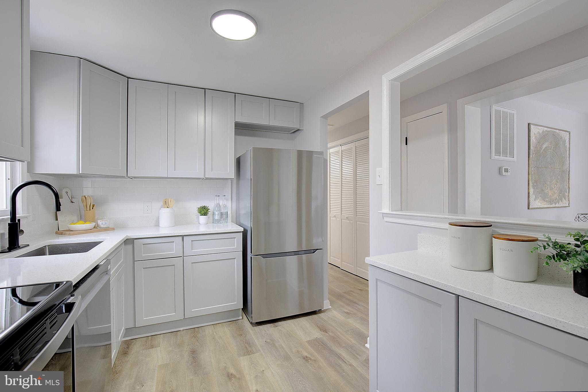 12070 Rousby Hall Road Lusby, MD 20657 - Photo 15 of 36 a kitchen with a sink appliances and cabinets
