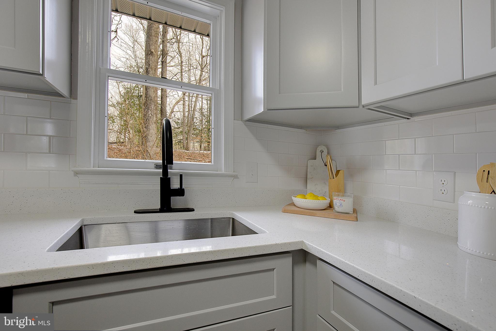 12070 Rousby Hall Road Lusby, MD 20657 - Photo 20 of 36 a kitchen with sink and window