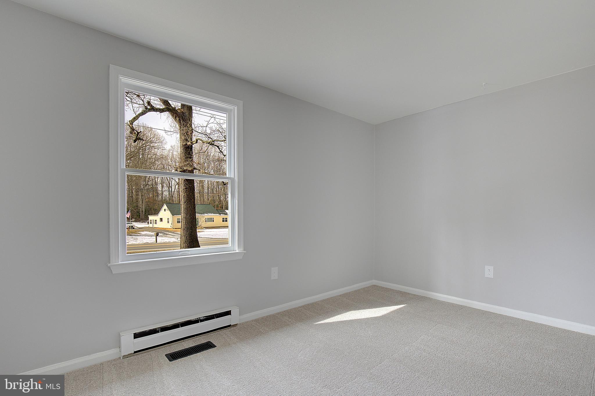 12070 Rousby Hall Road Lusby, MD 20657 - Photo 21 of 36 an empty room with a window