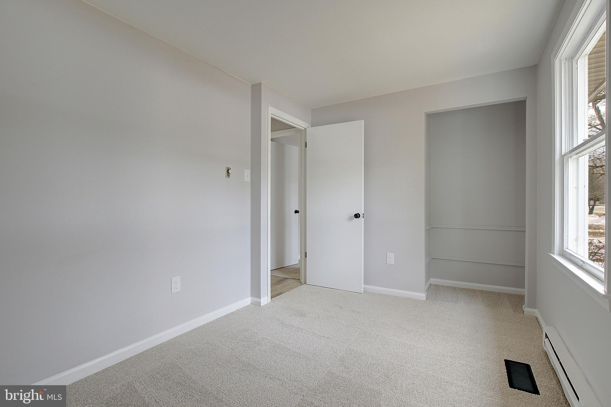 12070 Rousby Hall Road Lusby, MD 20657 - Photo 22 of 36 an empty room with windows