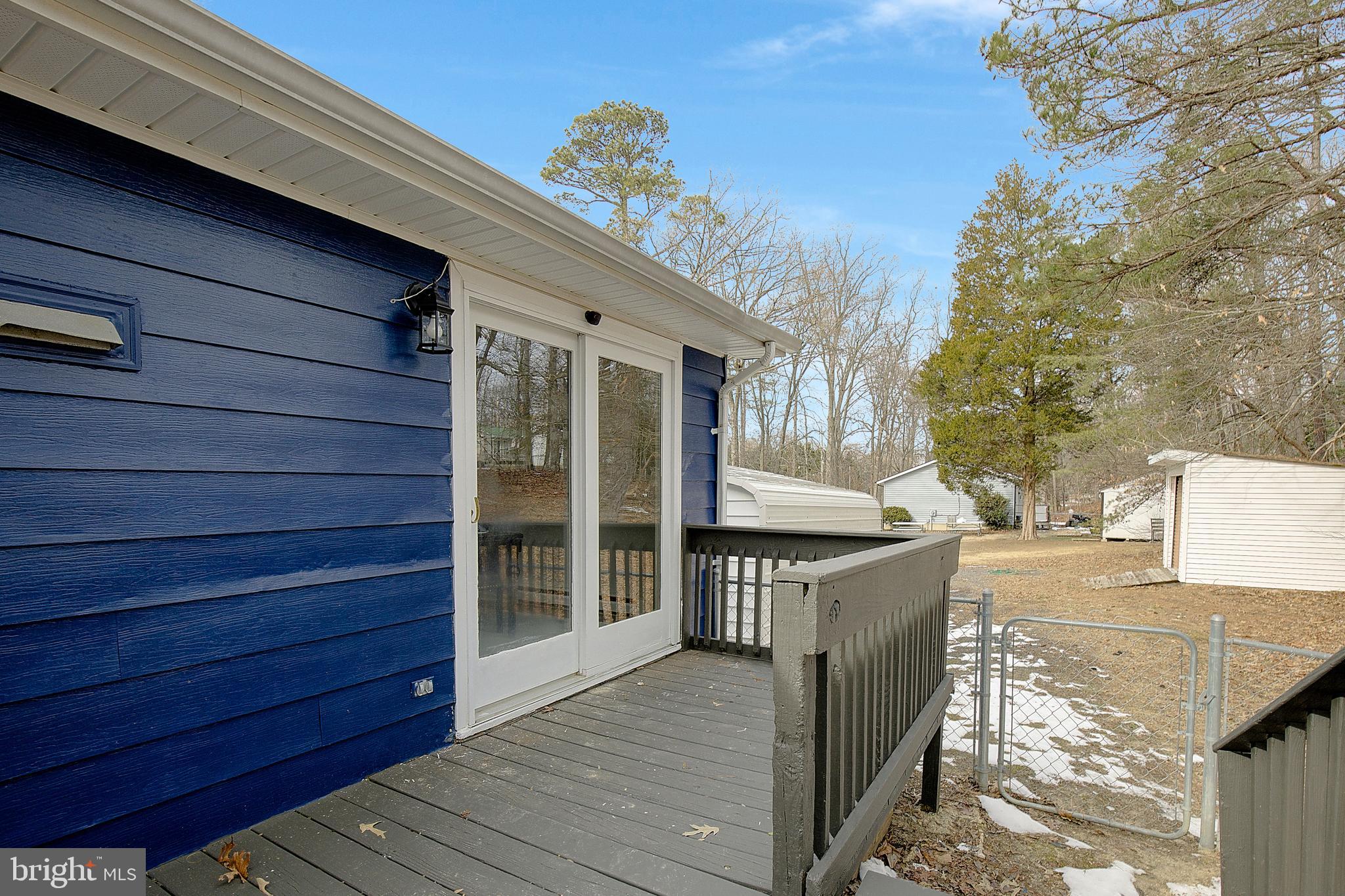 12070 Rousby Hall Road Lusby, MD 20657 - Photo 30 of 36 a outdoor space with wooden floor and windows