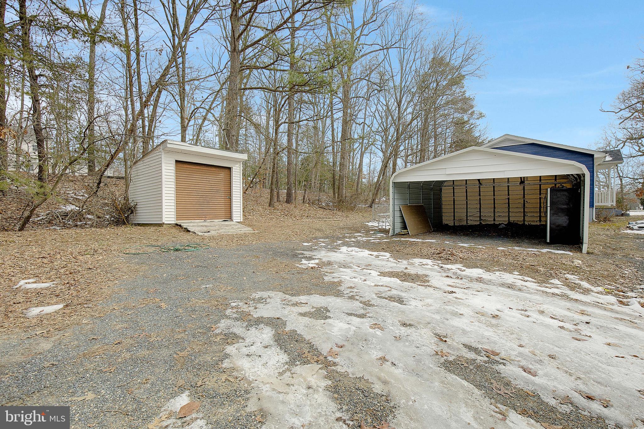 12070 Rousby Hall Road Lusby, MD 20657 - Photo 34 of 36 a view of a backyard with a house