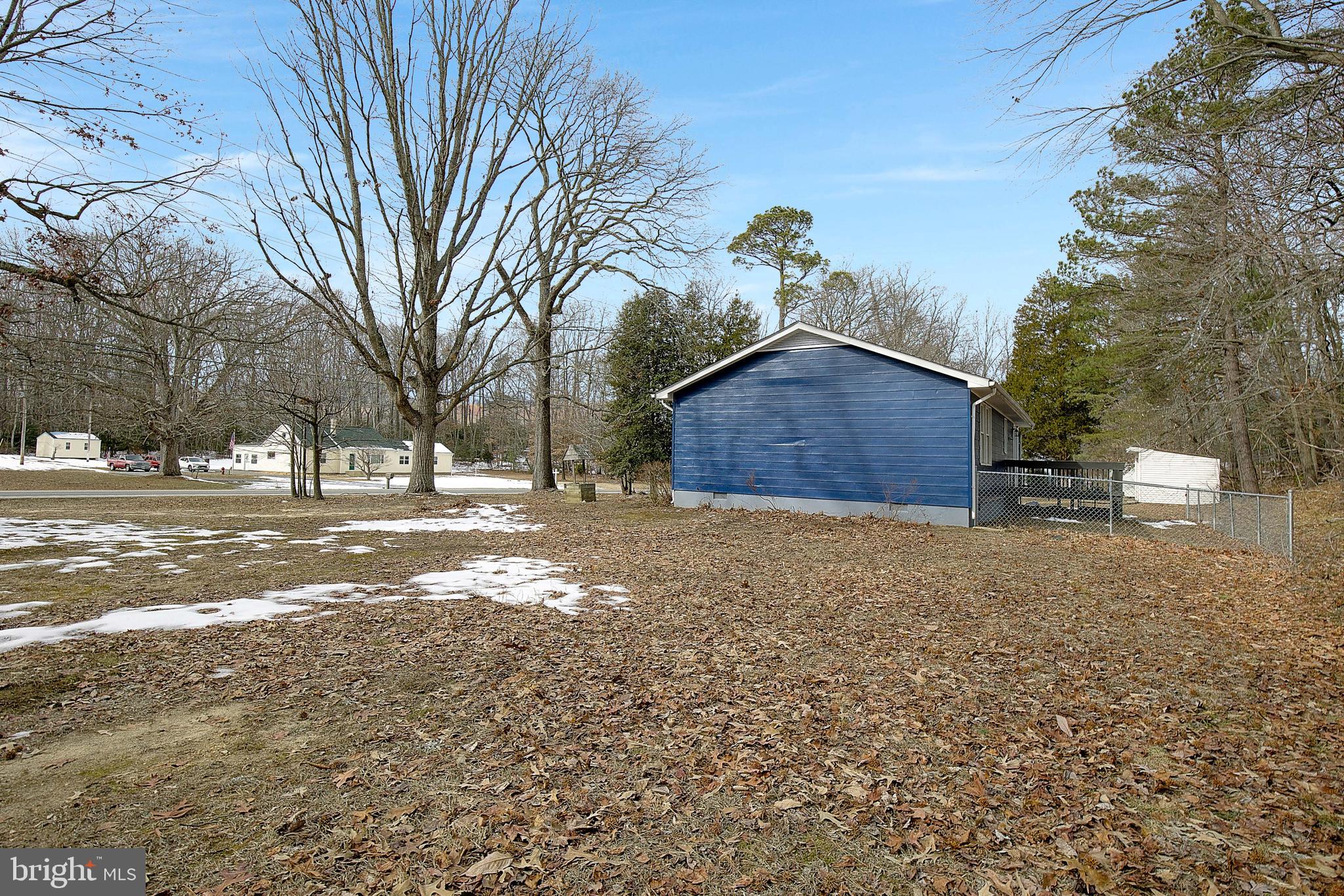 12070 Rousby Hall Road Lusby, MD 20657 - Photo 36 of 36 a view of a house with a yard