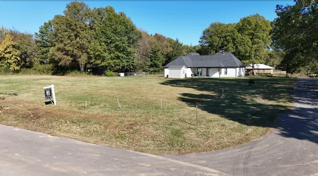 a view of a yard with an outdoor space