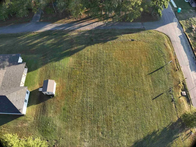 a view of a lake with a building in the background