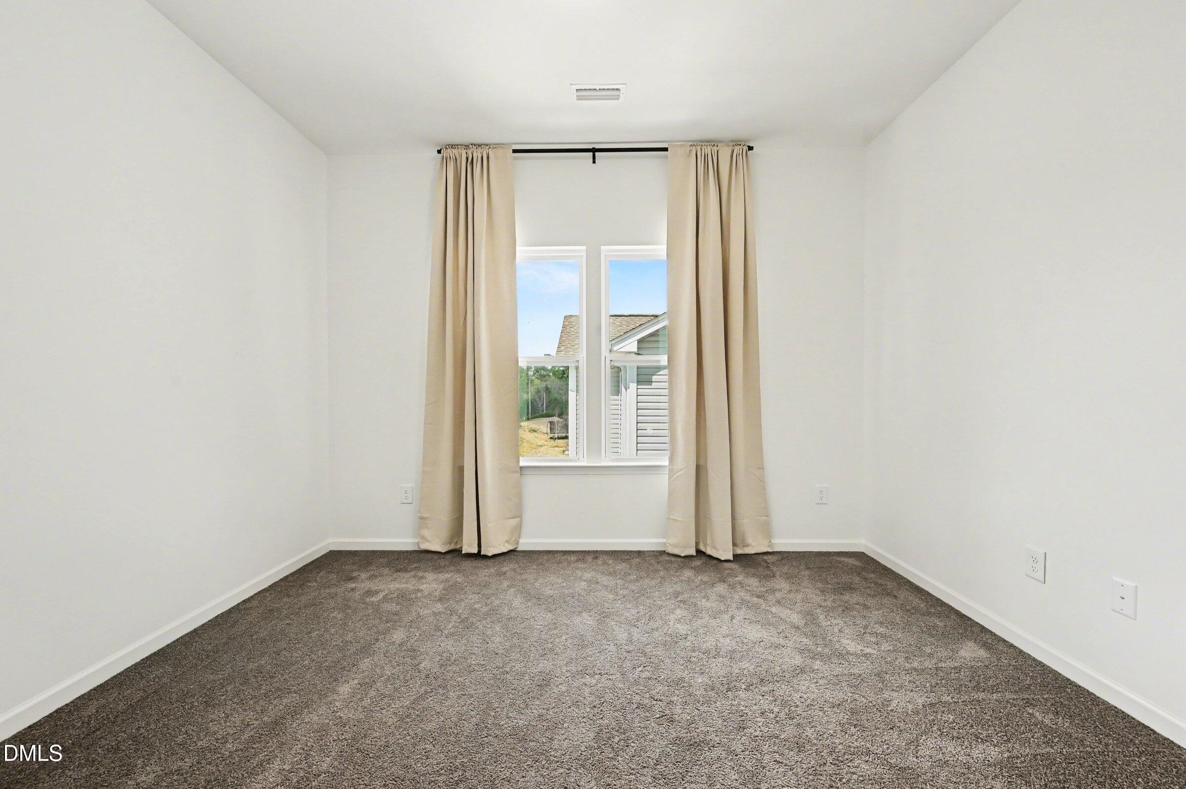 7015 Grainfield Road Mebane, NC 27302 - Photo 29 of 42 an empty room with a window