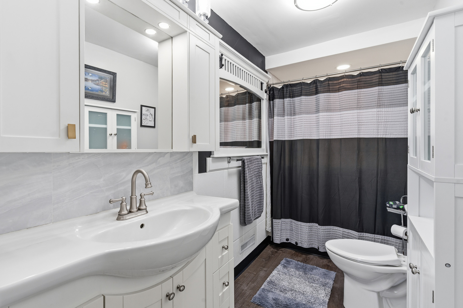 310 Godfrey Avenue Lockport, IL 60441 - Photo 17 of 65 a bathroom with a sink toilet and shower
