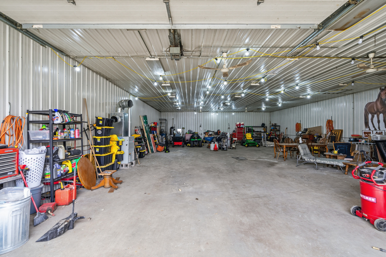 310 Godfrey Avenue Lockport, IL 60441 - Photo 3 of 65 a view of a storage room with a lot of stuff and toys