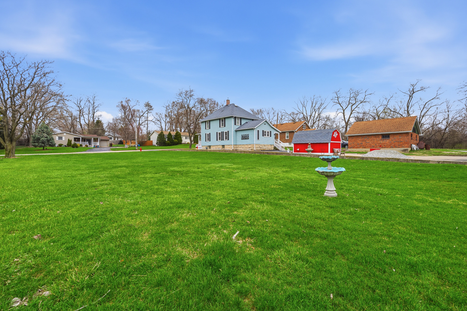 310 Godfrey Avenue Lockport, IL 60441 - Photo 47 of 65 a view of a house with a big yard and large trees