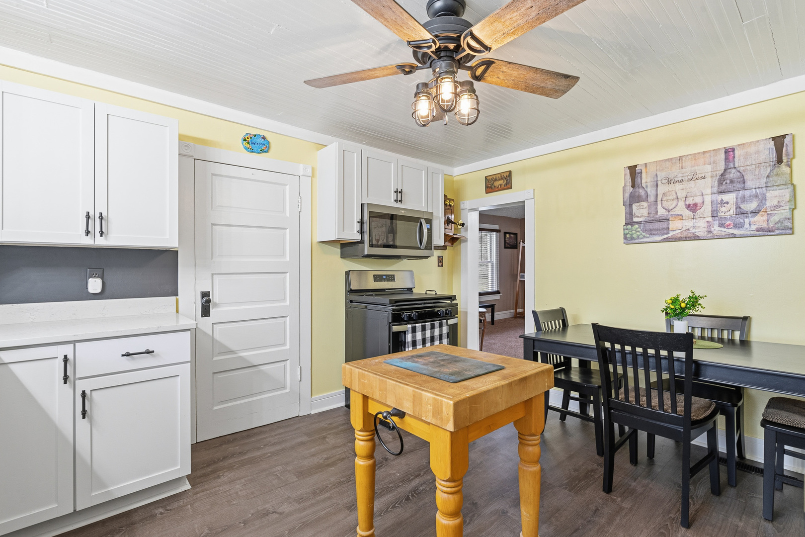 310 Godfrey Avenue Lockport, IL 60441 - Photo 5 of 65 a kitchen with a dining table chairs stainless steel appliances and cabinets