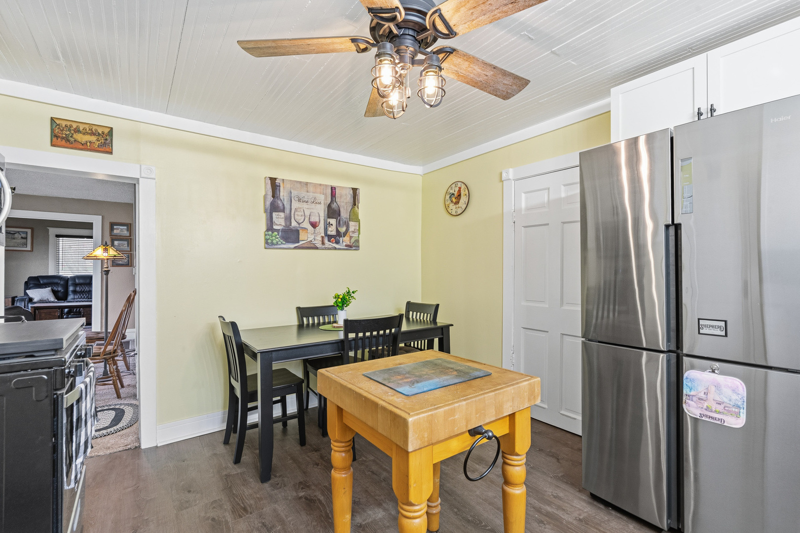 310 Godfrey Avenue Lockport, IL 60441 - Photo 6 of 65 a kitchen with a refrigerator a table and chairs in it