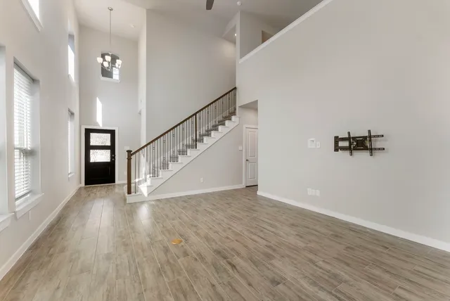a view of an entryway with wooden floor