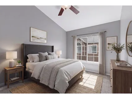 a bedroom with a bed a potted plant on dresser and a potted plant