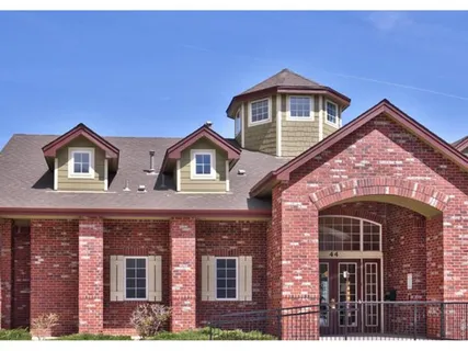 a view of a house with swimming pool and a yard