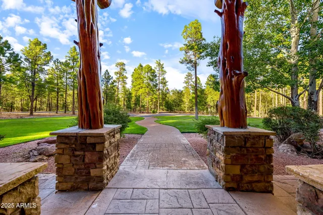 a kitchen with stainless steel appliances granite countertop a sink and a stove