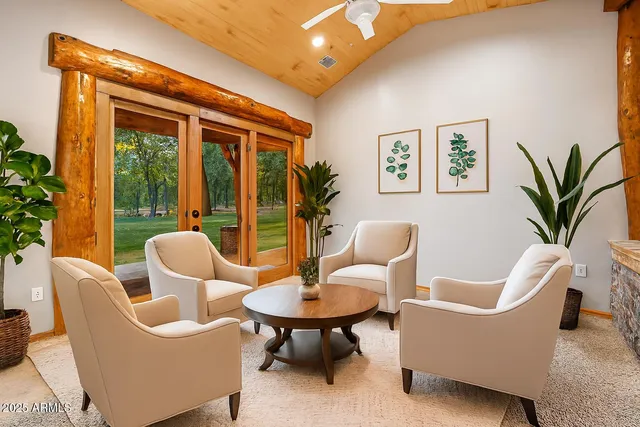 a view of a yard with plants and trees