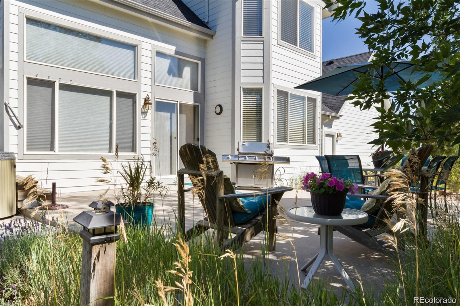 935 Green Gables Circle Bennett, CO 80102 - Photo 9 of 34 a view of dinning table and chairs in patio