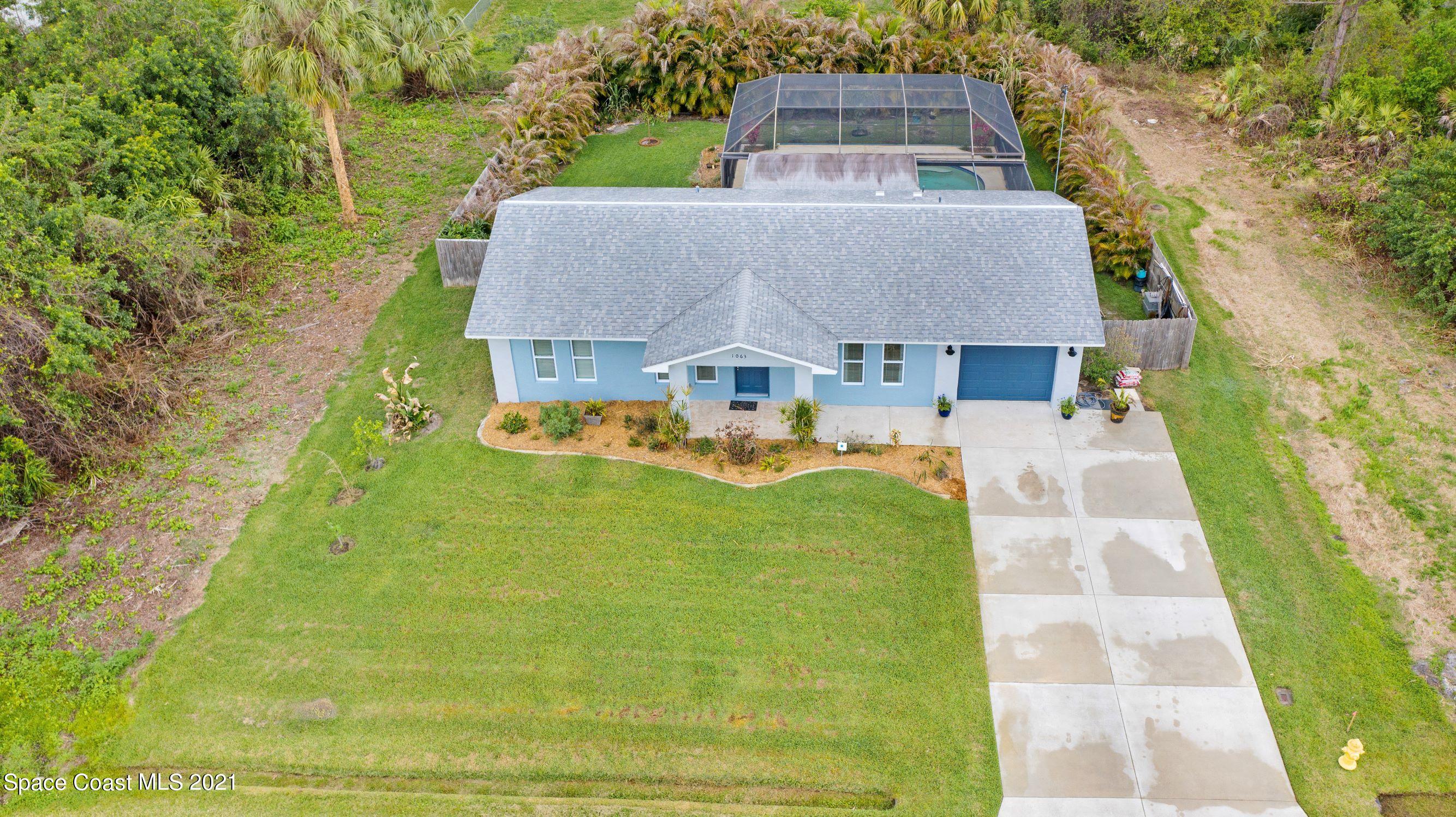 1063 Castile Road Southeast Palm Bay, FL 32909 - Photo 2 of 38 R_DJI_0522