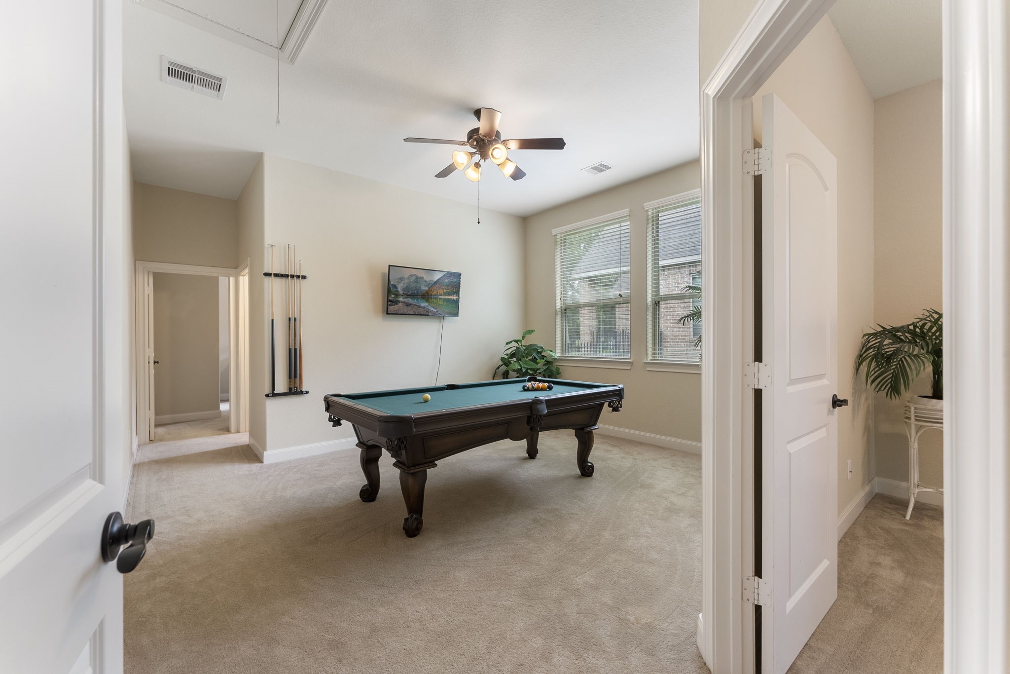 4787 Jackson Square Drive Conroe, TX 77304 - Photo 24 of 35
Tucked away in its own private wing, this thoughtfully designed space invites endless possibilities. Featuring a spacious game room perfect for entertaining or unwinding, a full bathroom for added convenience, and secondary bedrooms ideal for guests, family members, or even a home office setup, it’s a true retreat within the home. Whether you're hosting game night, accommodating loved ones, or seeking a quiet corner to work or relax, this versatile area offers both privacy and function, seamlessly tailored
