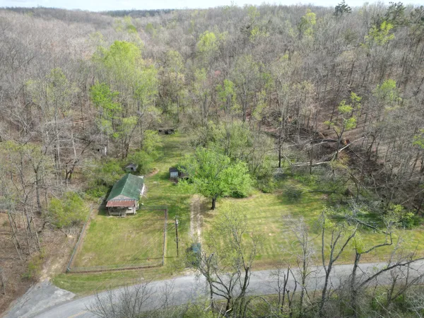 a aerial view of residential houses with outdoor space