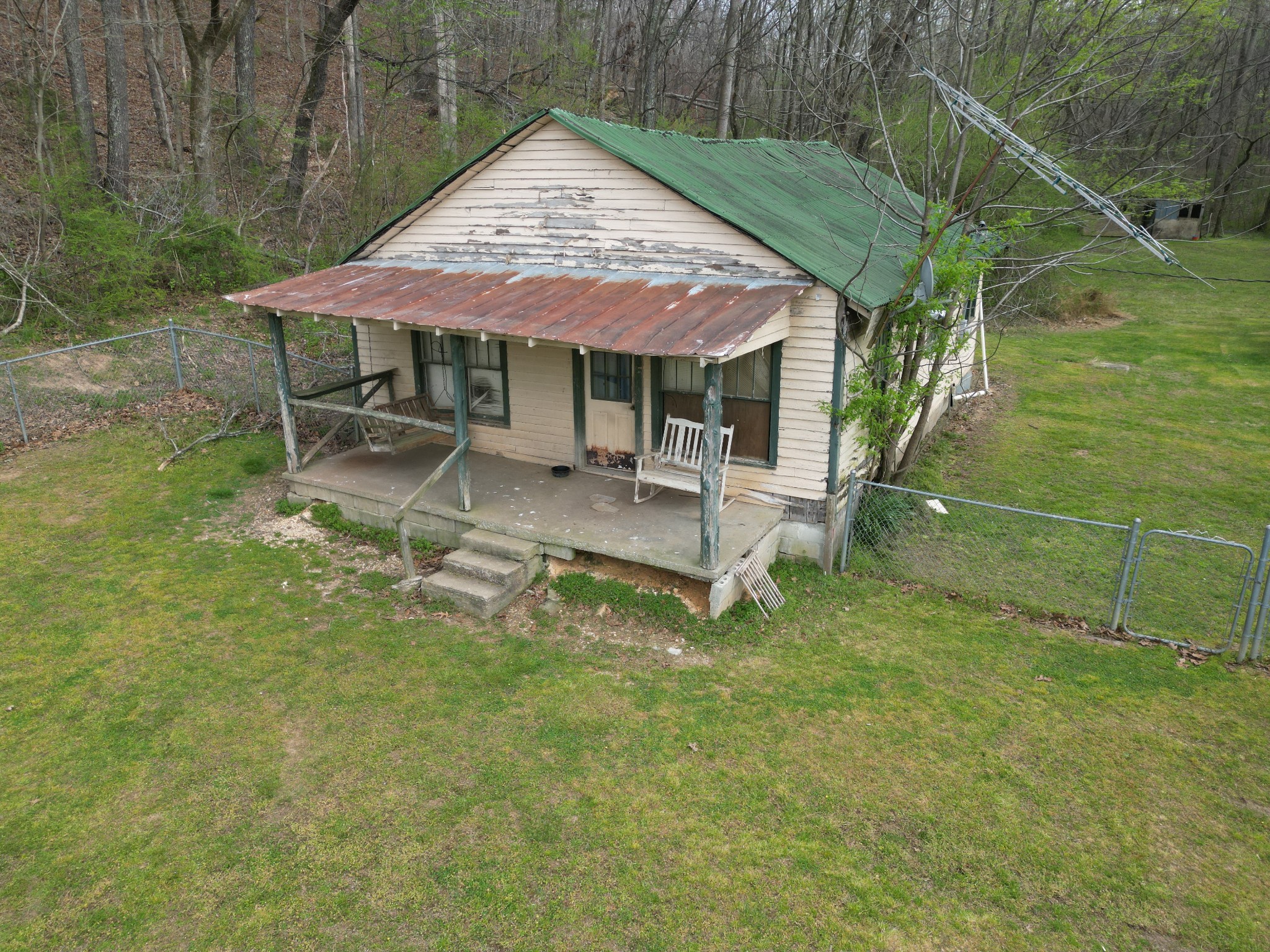 417 Trace Creek Road Hohenwald, TN 38462 - Photo 33 of 34 a backyard of a house with table and chairs