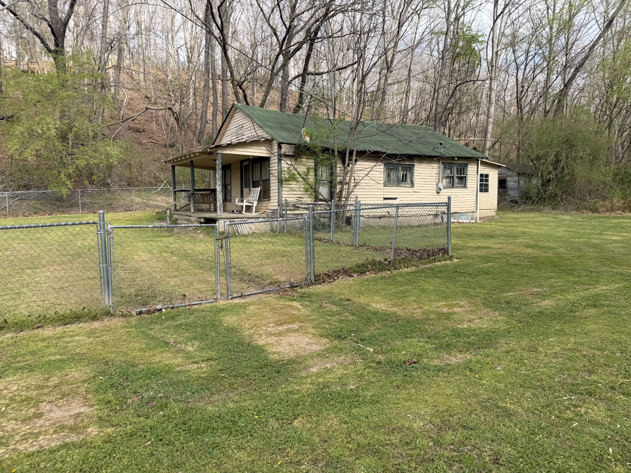 417 Trace Creek Road Hohenwald, TN 38462 - Photo 8 of 34 a front view of a house with garden