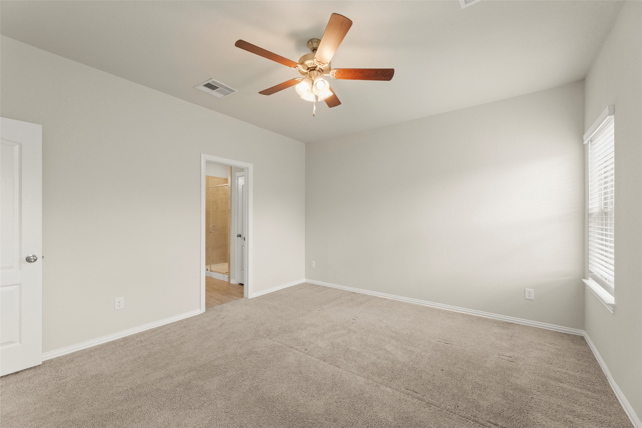 31322 Conover Drive Fulshear, TX 77441 - Photo 13 of 38 a view of an empty room with a window