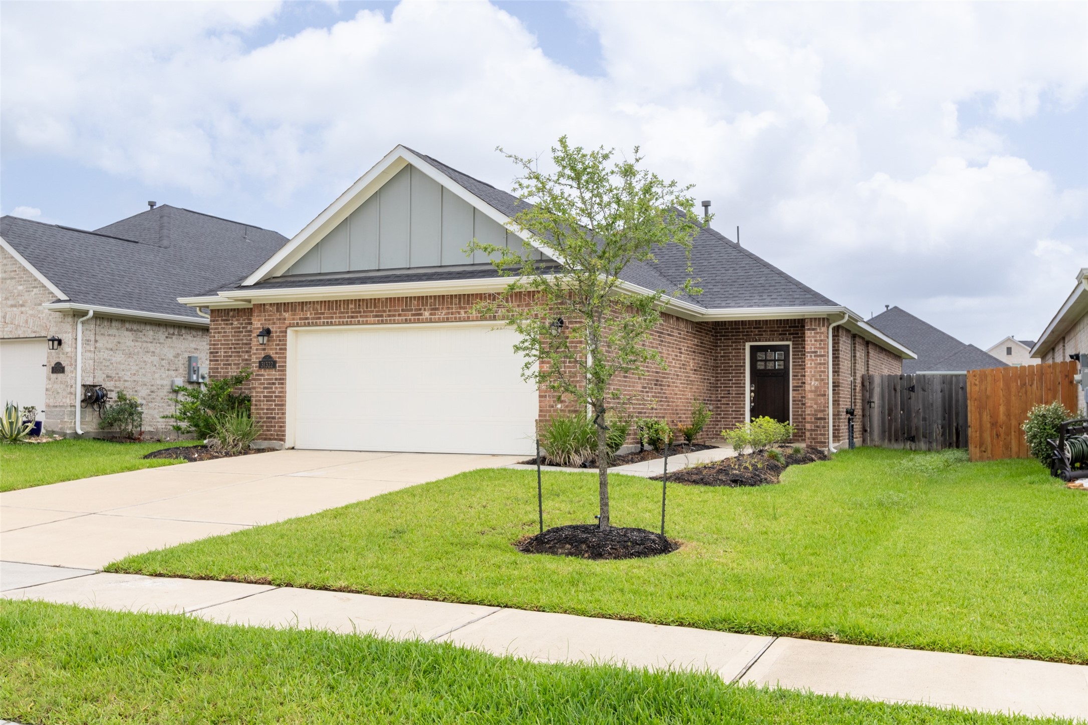 31322 Conover Drive Fulshear, TX 77441 - Photo 25 of 38 a front view of a house with a yard and garage