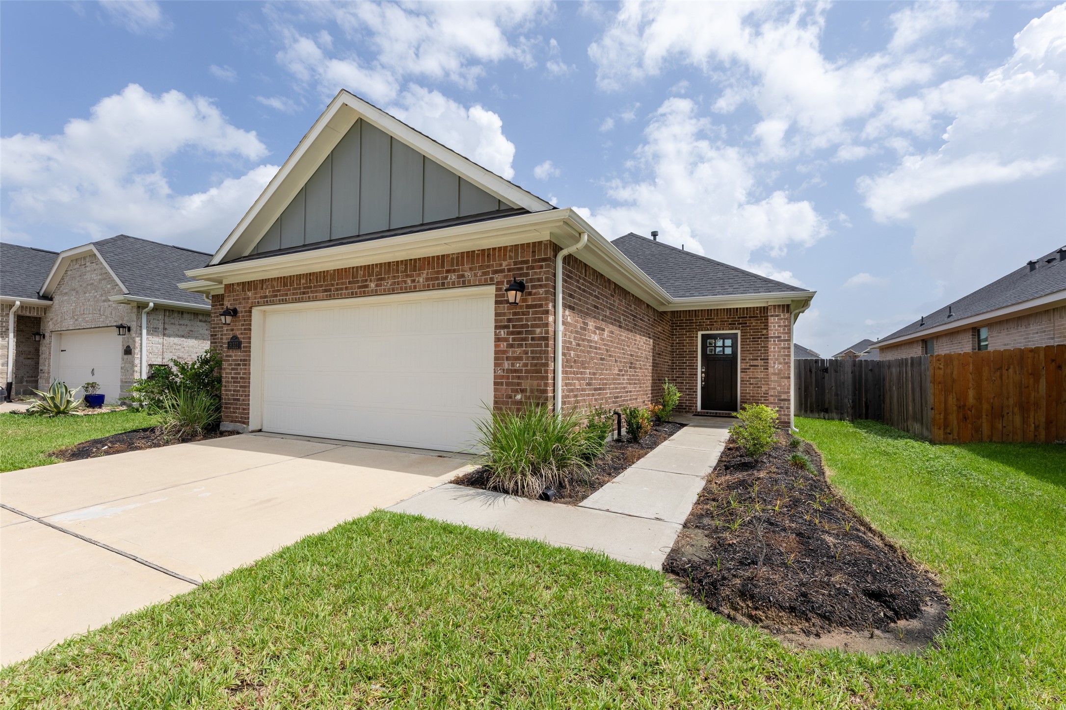 31322 Conover Drive Fulshear, TX 77441 - Photo 26 of 38 a front view of a house with garden