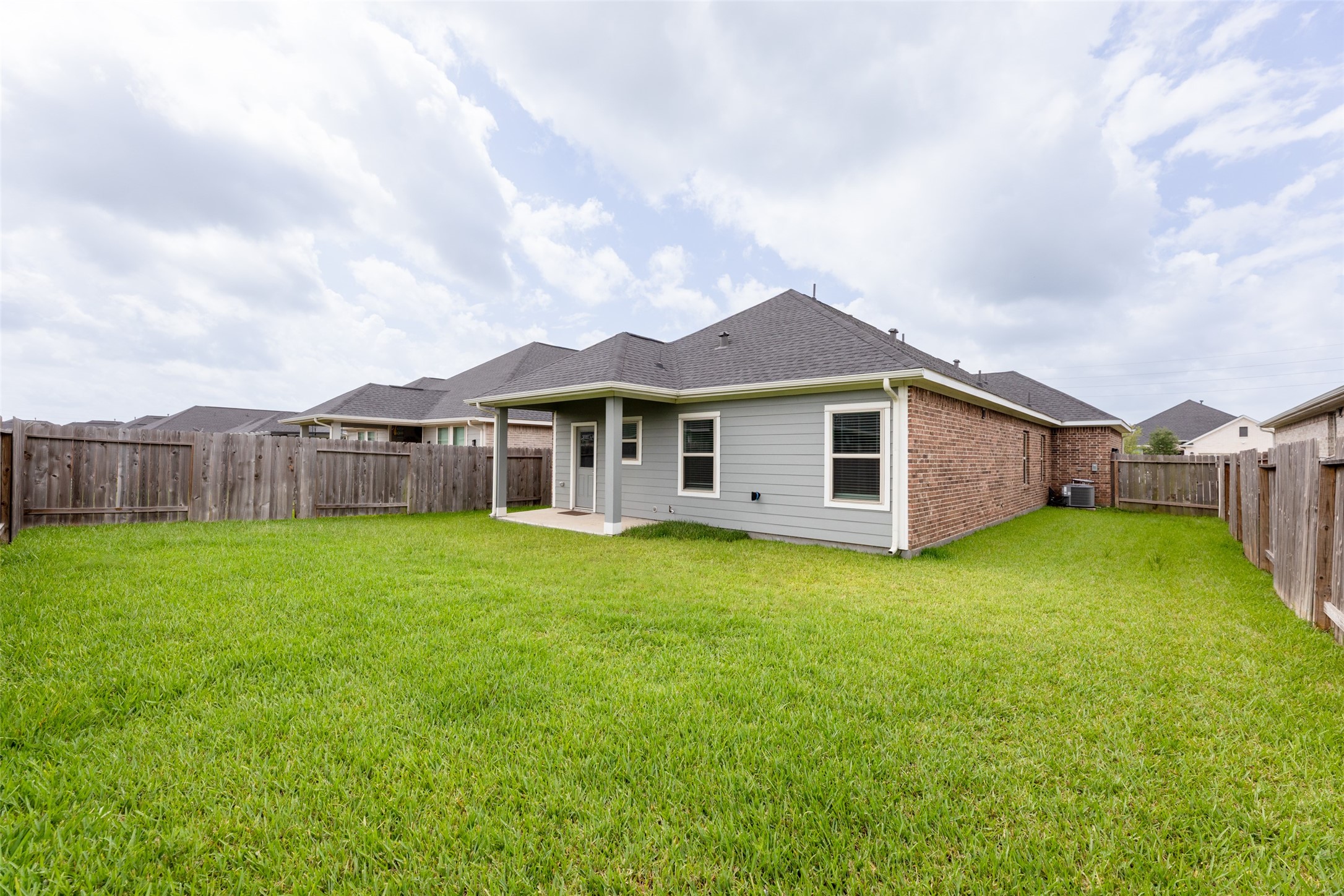 31322 Conover Drive Fulshear, TX 77441 - Photo 28 of 38 a view of a house with a back yard