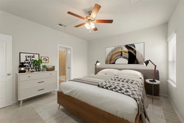 a bedroom with a bed and a dresser