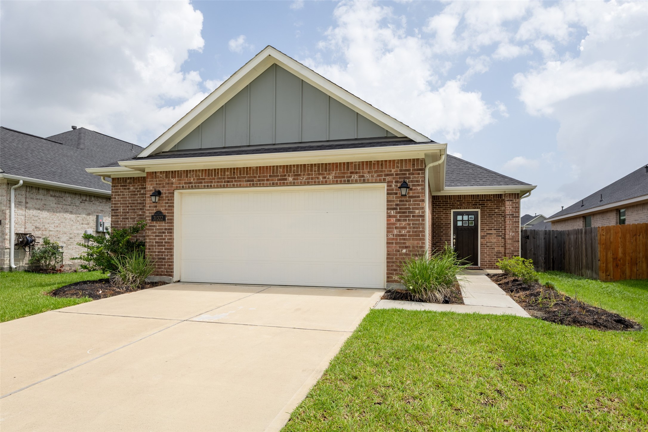31322 Conover Drive Fulshear, TX 77441 - Photo 5 of 38 a front view of house with backyard and green space