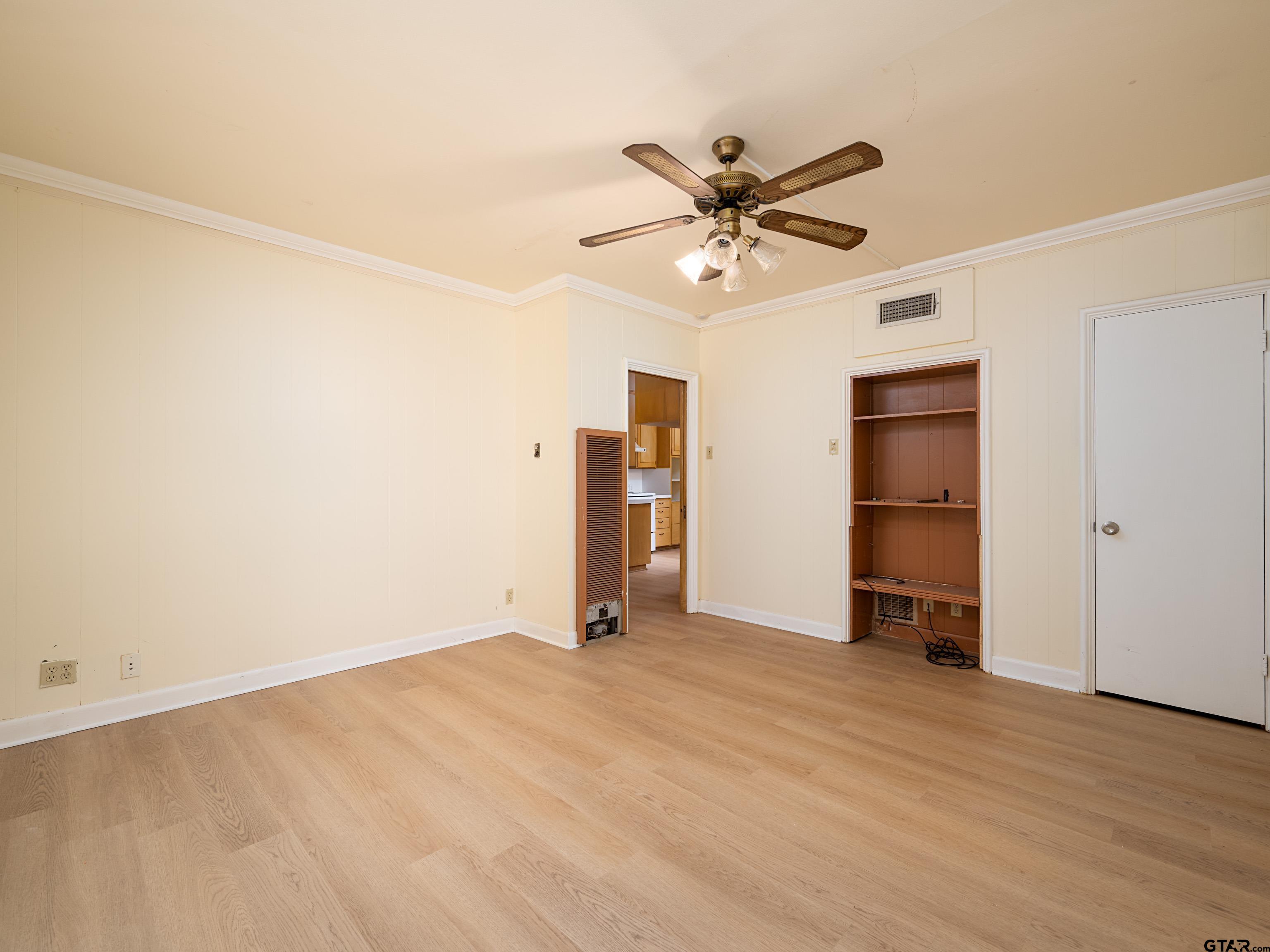 201 West Rusk Street Tyler, TX 75701 - Photo 18 of 30 a view of empty room with wooden floor and window