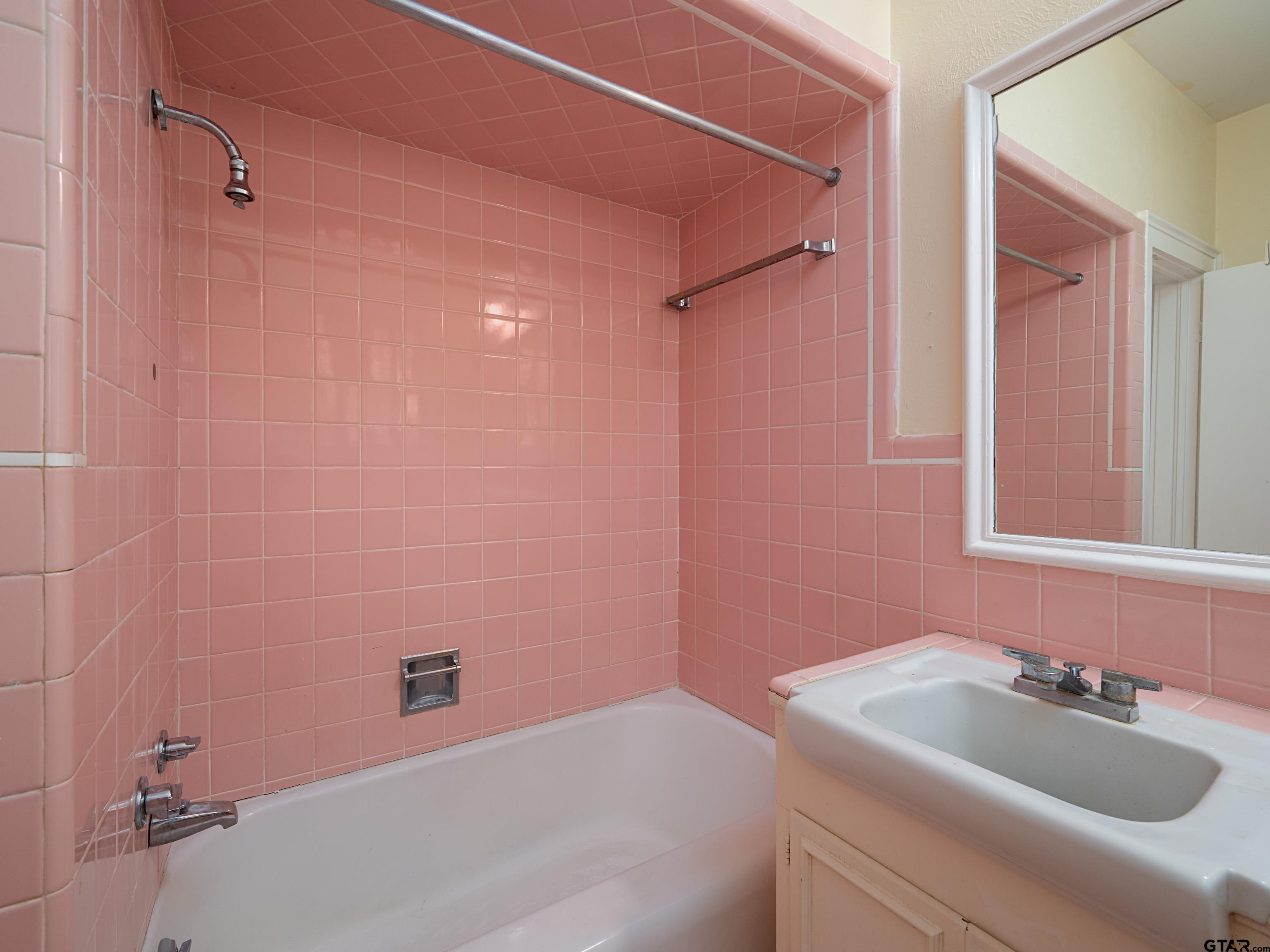 201 West Rusk Street Tyler, TX 75701 - Photo 25 of 30 a bathroom with a sink and a bathtub
