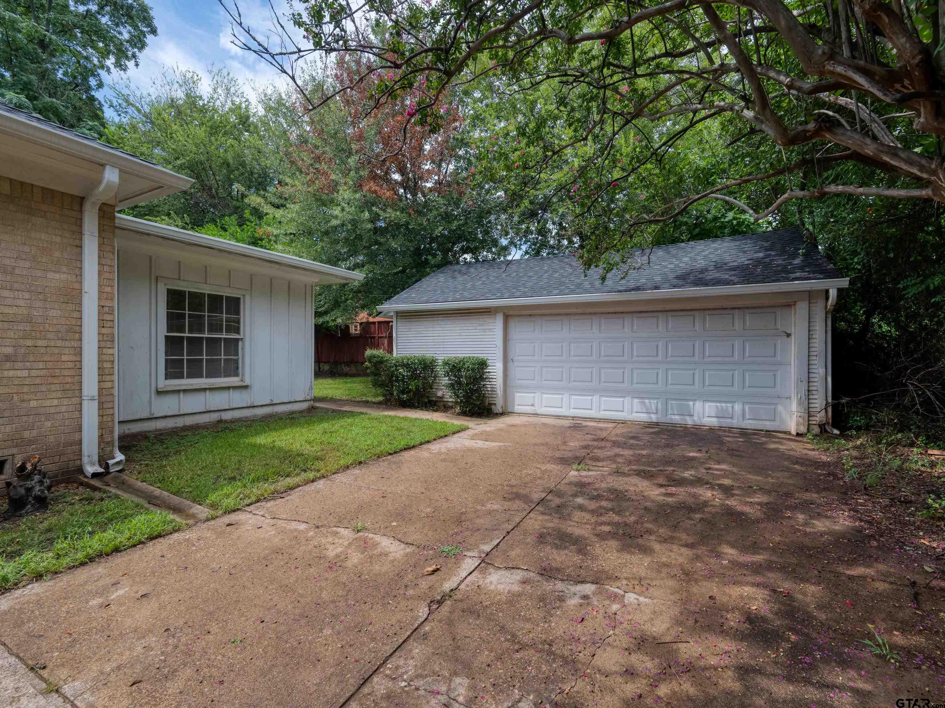 201 West Rusk Street Tyler, TX 75701 - Photo 28 of 30 a view of a house with a yard and large tree